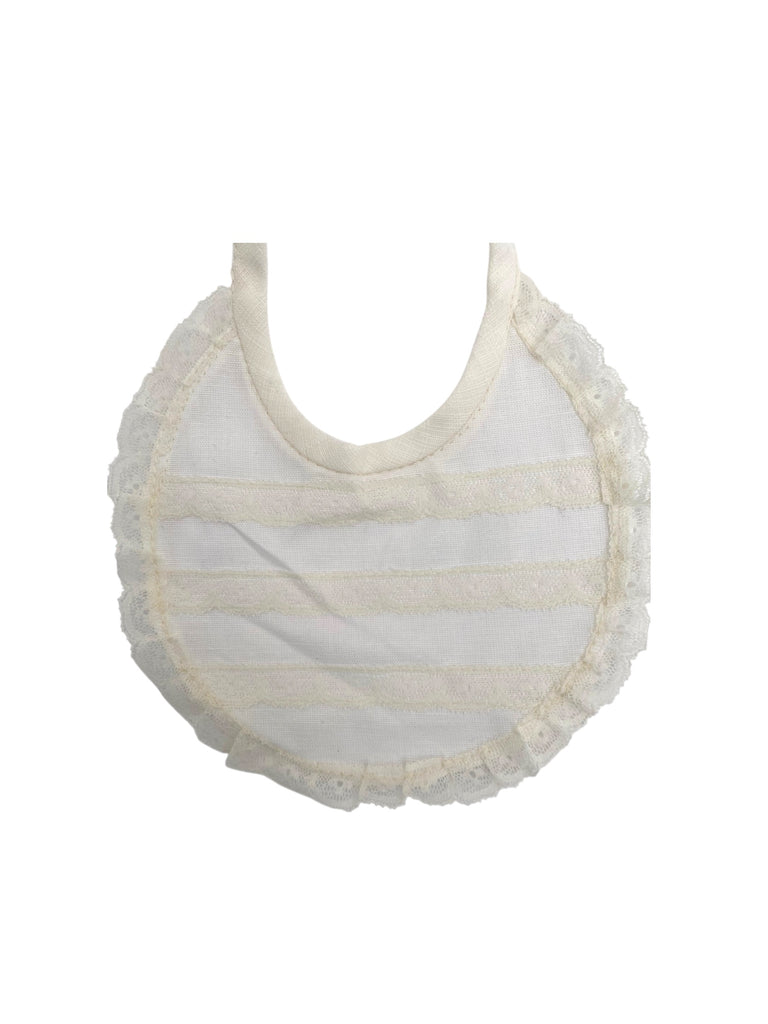 Babero de lino con tira de bolillo